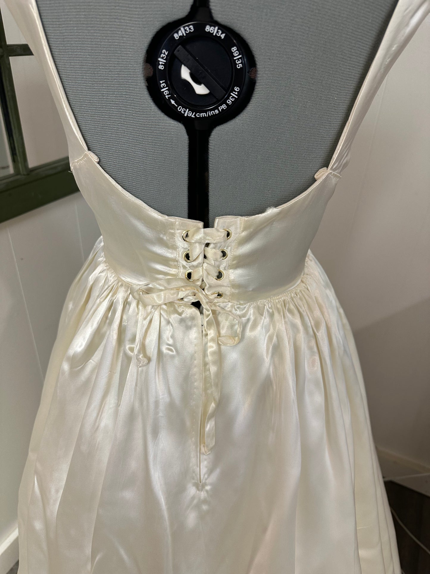 Fifer is a unique reworked ivory wedding dress of satin