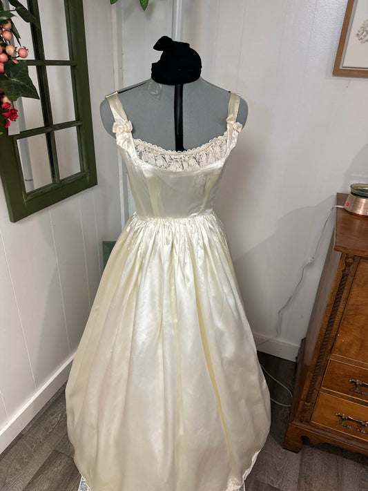 Fifer is a unique reworked ivory wedding dress of satin