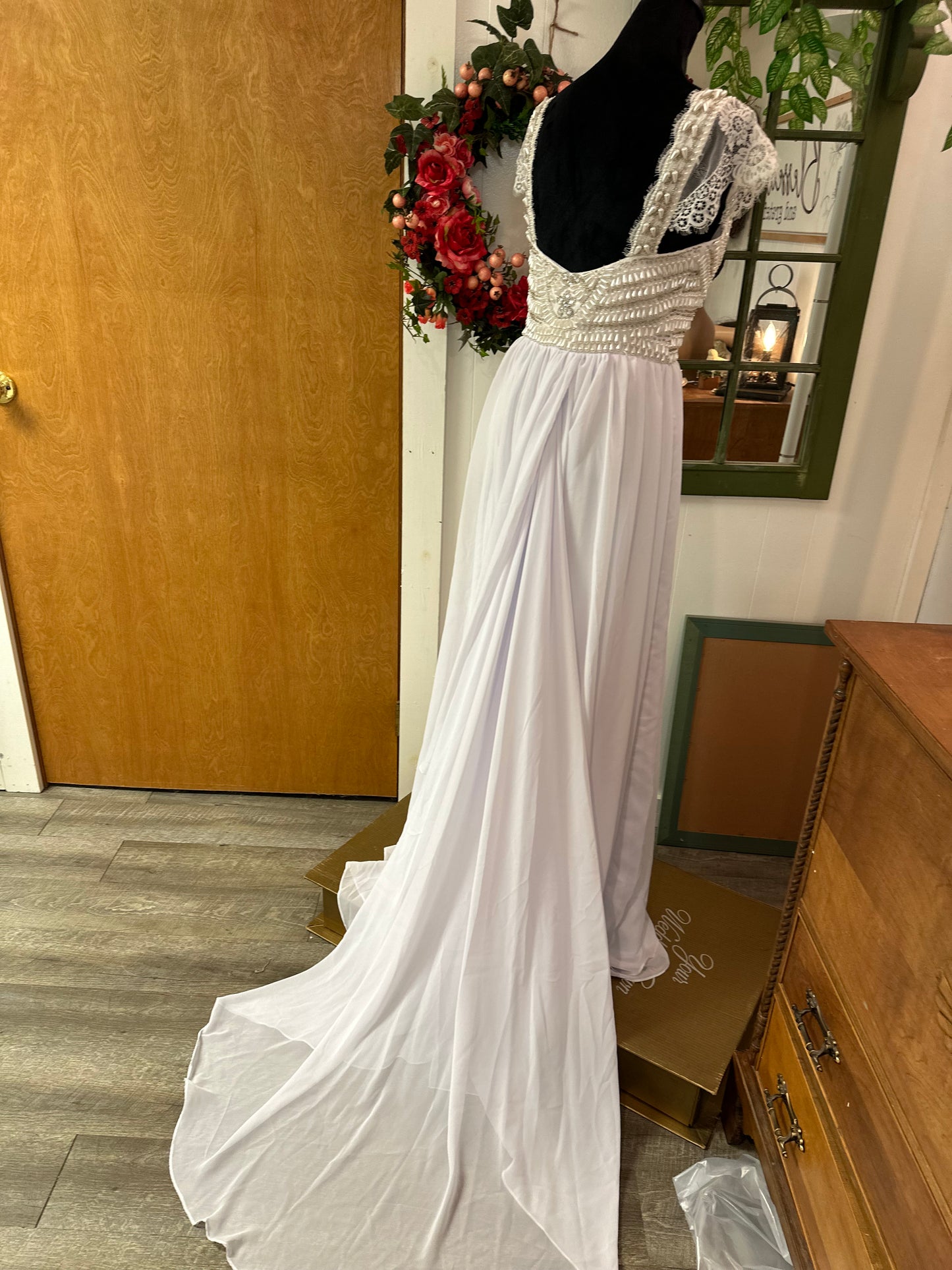 Abby is a new gown without tags. Bohemian influence wedding dress