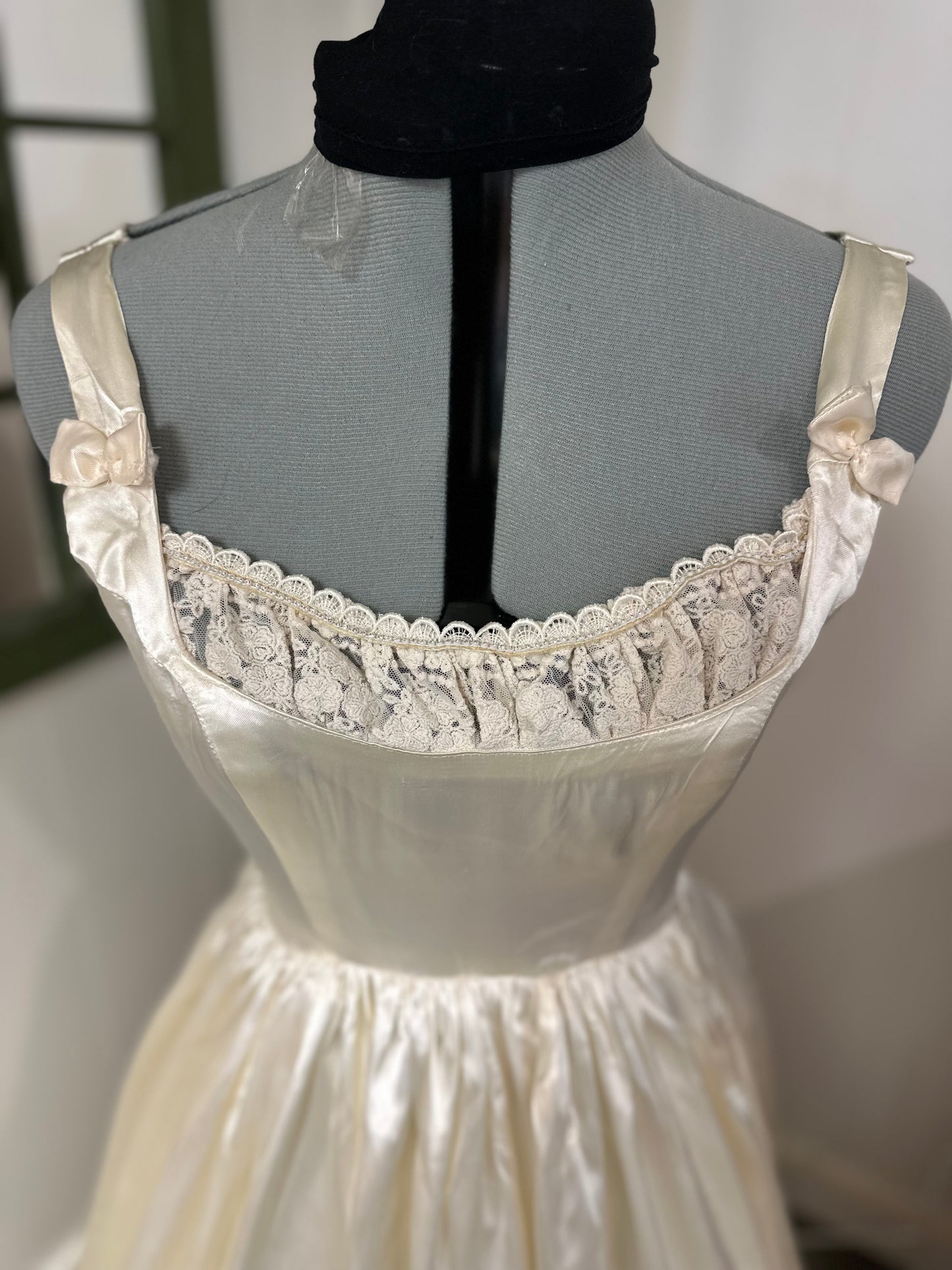 Fifer is a unique reworked ivory wedding dress of satin