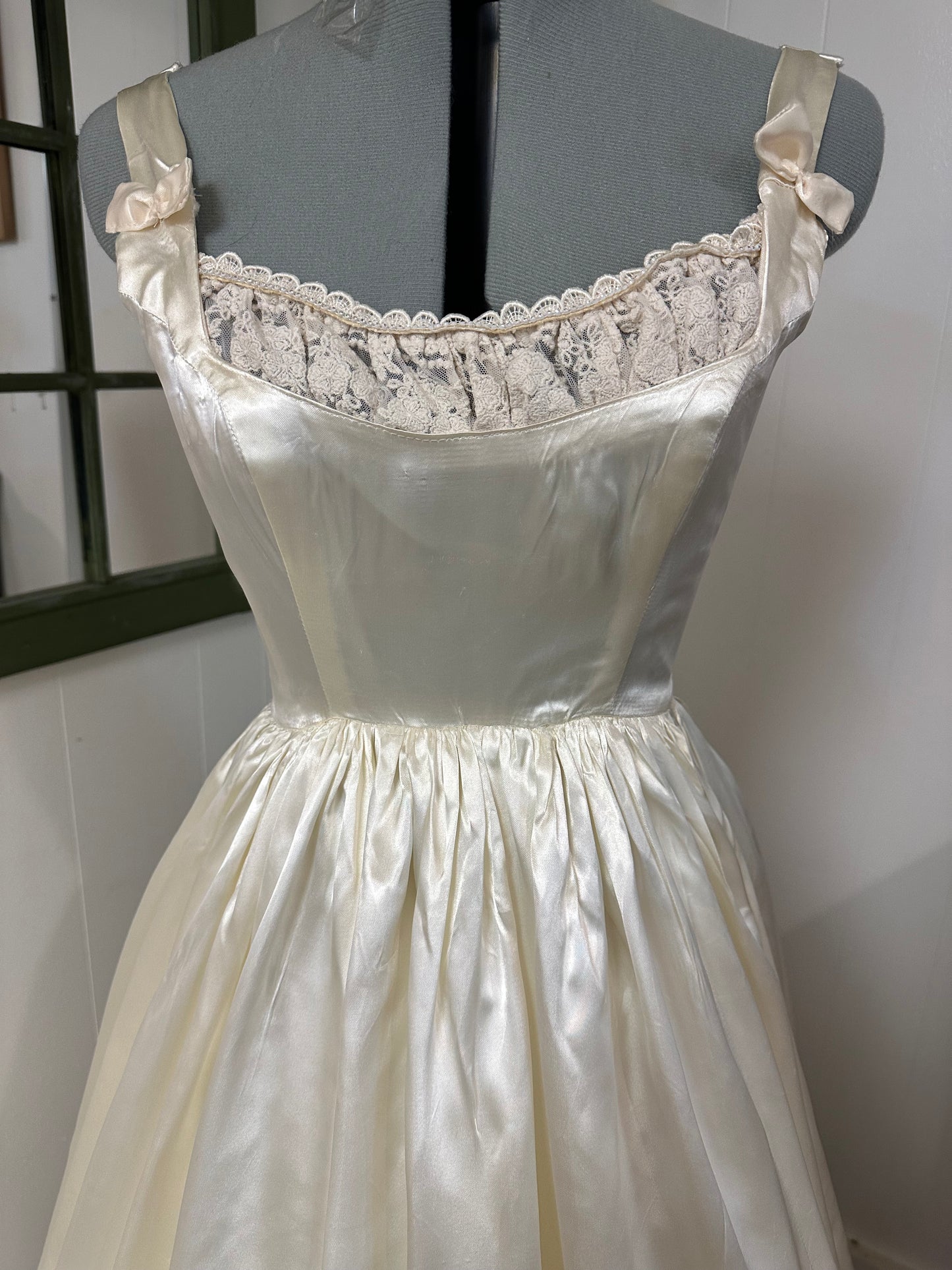 Fifer is a unique reworked ivory wedding dress of satin