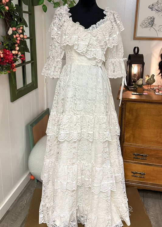 Tille is a vintage lace ivory 1980s wedding dress