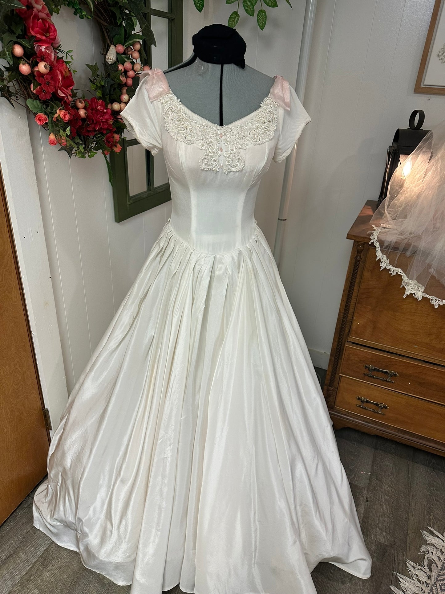 Sutton is a vintage 1950s wedding dress in pale ivory