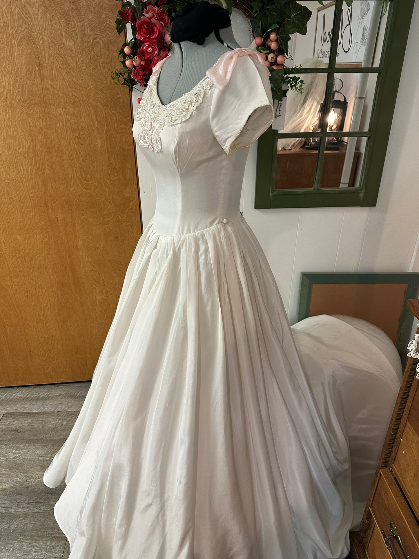 Sutton is a vintage 1950s wedding dress in pale ivory