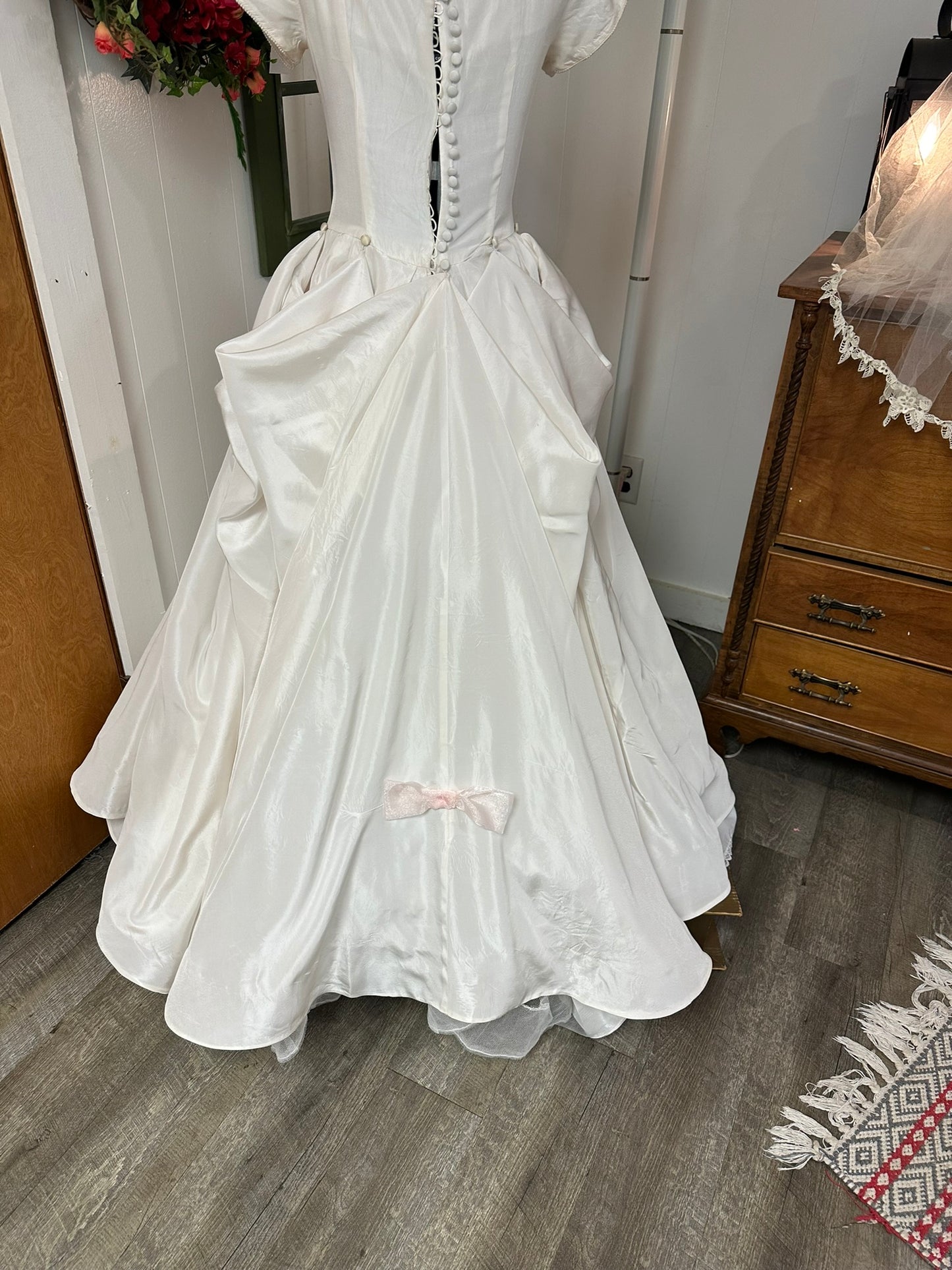 Sutton is a vintage 1950s wedding dress in pale ivory